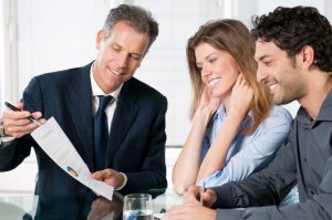 A personal injury solicitor for an Aldershot injury claim showing clients an agreement form