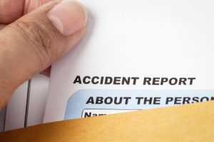 Someone holding an accident report