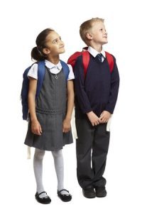 Two schoolchildren stood next to each other