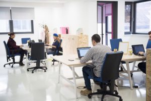 employees working away in an office environment. 