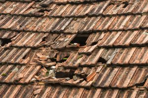 Loose slate/tiles on roof leak 