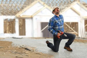 A man injuring his back at work.