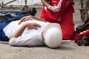 Worker lying on the floor after an accident at work. 