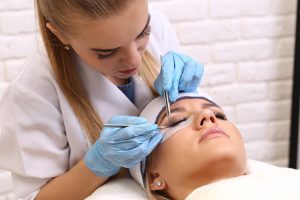 Woman Receiving Eyelash Extensions 