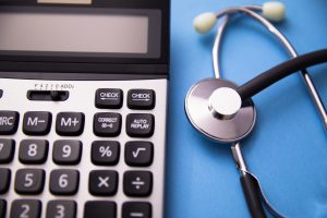 A compensation calculator with a stethoscope 