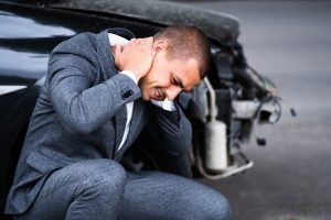 Man After A Car Accident Holding His Neck. 