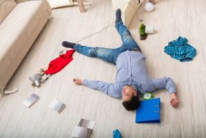 Injured man lying on back after an accident at home