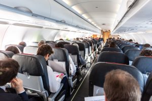 People sitting on an aircraft. 