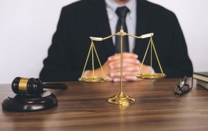A solicitor on a medical negligence team sits behind a desk while working on eye surgery negligence claims.