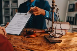 A solicitor and their client discussing arson injury compensation in an office