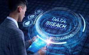 A man with the conceptual words data breach 