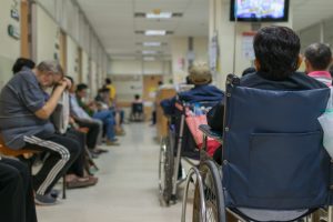 A hospital waiting room full of people waiting for treatment