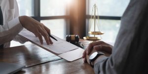 A solicitor helps a client with their claim