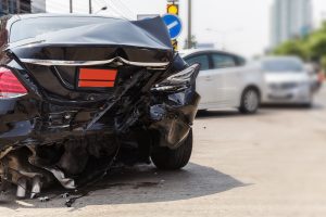 A car with a damaged rear end after the driver lost control of vehicle when coming round round a bend. 