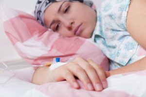 A close-up of a female patient lying on a bed.