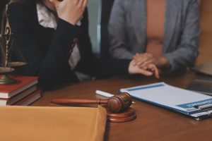 A solicitor discuss trailing leads hazards claims with their client 