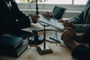 Solicitors having a meeting to discuss the financial impact of a terrorist incident on their client