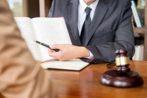 A solicitor discussing zoo accident compensation claims with their client at a desk